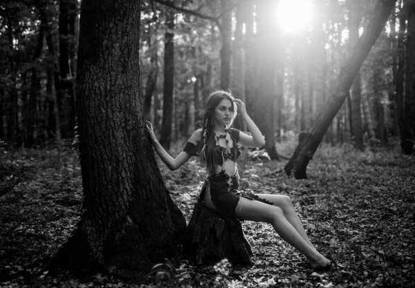 Female spirit mythology. Wilderness of virgin woods. She belongs tribe warrior women. Wild attractive woman in forest. Folklore character. Living wild life untouched nature. Sexy girl. Wild human.