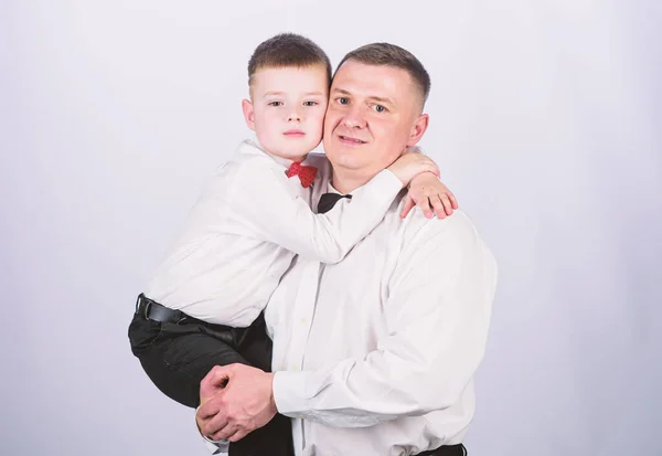 small boy with dad gentleman. family day. happy child with father. business meeting. male fashion. parenting. fathers day. father and son in formal suit. tuxedo style. Wedding party. happy family day