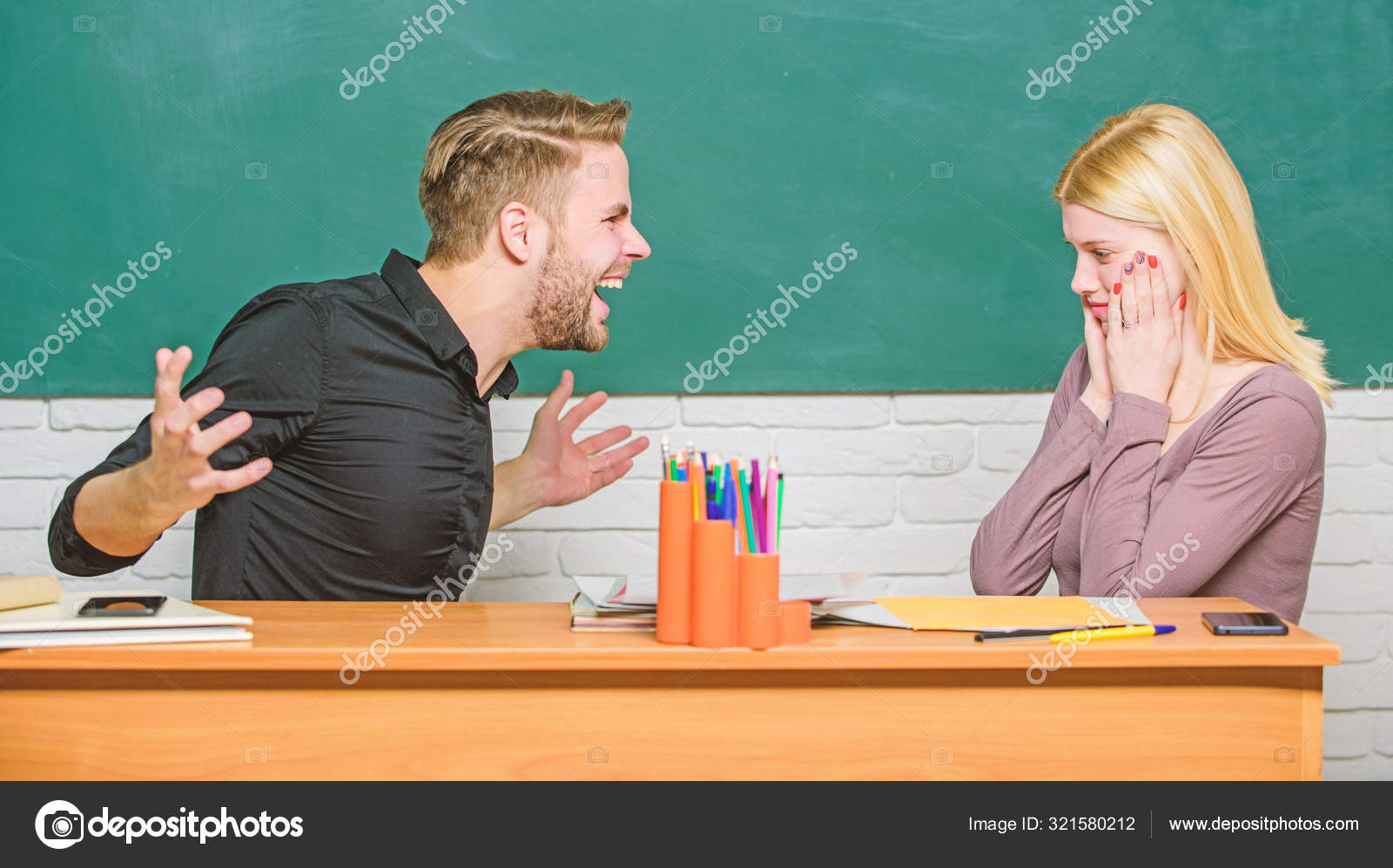 Our teacher insisted. Злой учитель за столом. Учитель сидит за столом. Пара учится. Учителя разочарованы.