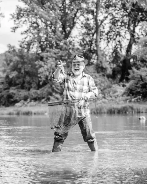 Retirement Is Just The Beginning. pothunter. man catching fish. mature man fishing. retired bearded fisher. big game fishing. weekend. fisherman with fishing rod. sport activity and hobby. Trout bait — Stock Photo, Image