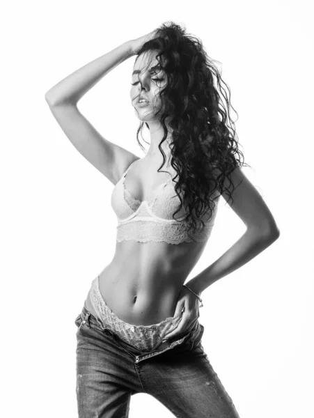 Fashion beauty. Diet and fitness.. woman with perfect body relax. sensual girl with curly hair. Flexible body. erotic games. Isolated on white. sexy woman in jeans and bra. In her own style — Stock Photo, Image