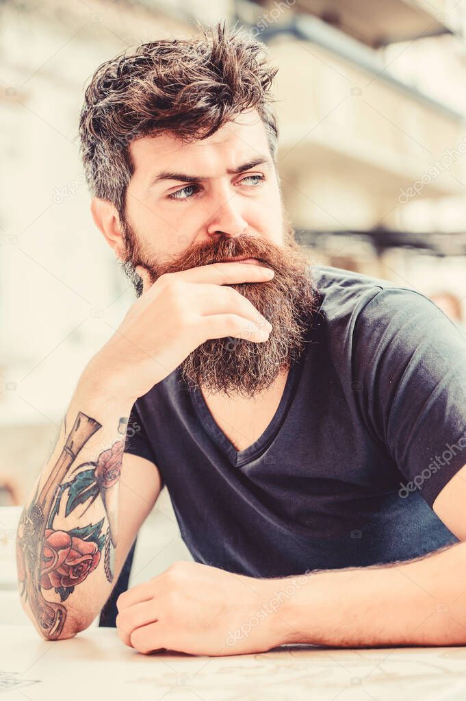 waiting and tinking. thoughtful man outdoor. Facial skin care. Bearded man feel loneliness. Mature hipster with beard hair. brutal male needs barber. Hip and stylish