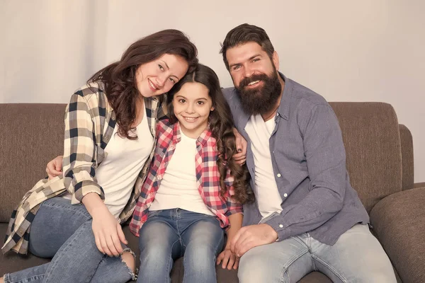 happy family relax at home. family weekend. mother and father love daughter. little girl with parents. trust and bonds. bearded man and woman with child. Enjoying time together. you are my family