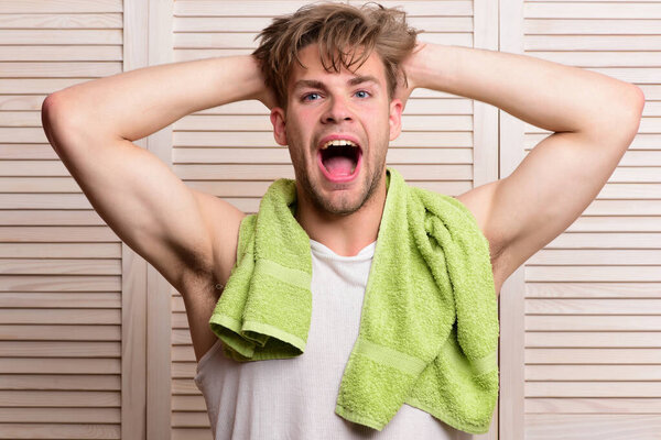 Athlete with strong muscles after morning shower. Morning exercises concept