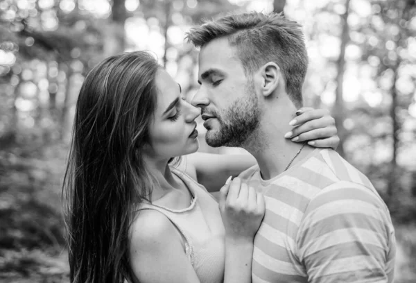 Giving kiss. Seduction and foreplay. Sensual kiss of lovely couple close up. Couple in love kissing with passion outdoors. Man and woman attractive lovers romantic kiss. Passionate kiss concept — Stock Photo, Image