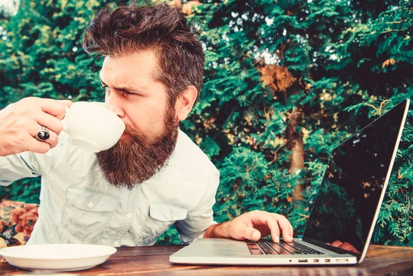 agile business. Business success. brutal bearded hipster at coffee break. office worker. Successful businessman. perfect deal. happy man working on laptop. lunch time. Earn money easy business tips