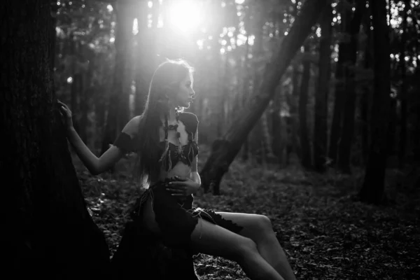 Living wild life untouched nature. Sexy girl. Wild human. Wilderness of virgin woods. She belongs tribe warrior women. Wild attractive woman in forest. Folklore character. Female spirit mythology