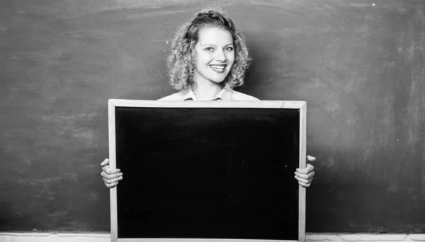 School bell schedule information. Teacher cheerful woman hold blackboard blank copy space. Remember this information. School information concept. Hometask information. Informing pupils. Breaking news