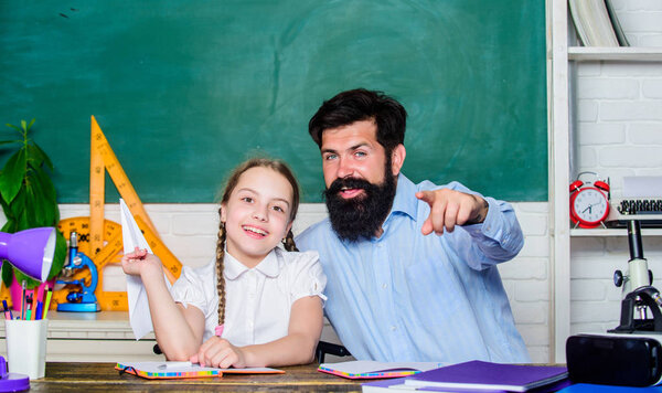 Developing caring learners who are actively growing and achieving. Man bearded pedagogue and pupil having fun. School learners leisure. Creating a community of learners. Teacher and schoolgirl