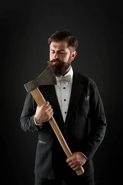 Brutal and bearded. Brutal groom hold axe. Hipster keep sharp axe blade at unshaven face. Bearded man with brutal look. Barbershop. Hair salon — ストック写真
