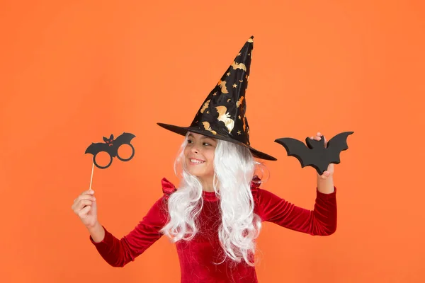 Ready to unleash flying bats. Little child dressed up as wicked witch for holiday party. Small girl wear Halloween holiday costume. Terrifying holiday celebration. Halloween holiday photo props — Stock Photo, Image
