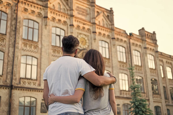 Happy together. Couple in love walking having fun. Tender hug. Love is a game that two can play and both can win. Couple relaxing enjoying each other. Hipster and pretty woman in love. Fall in love