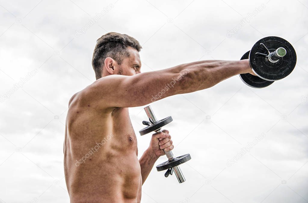Dare to be great. Sportsman strong biceps triceps. Gym workout. Workout fitness sport. Workout concept. Healthy mind in a healthy body. Muscular man exercising with dumbbell. Dumbbell exercise