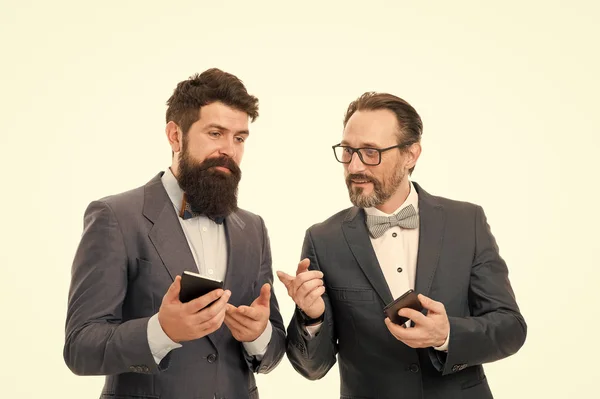 Good business talk. business communication on meeting. team success. mature men. Agile business. bearded businessmen in formal suit. collaboration and teamwork. partnership of men speaking on phone
