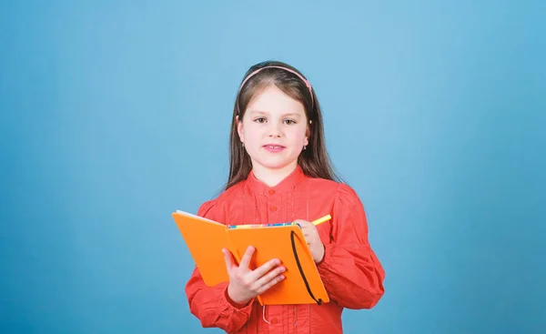 Focusing on education. Cute school child writing test on basic education. Little girl getting formal education in primary school. Early childhood education. — Stock Photo, Image