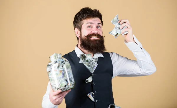 Security and cash money savings. Banking concept. Man bearded guy hold jar full of cash savings. Financial insurance. Personal accountant. Businessman with his dollar savings. Richness and wellbeing — ストック写真