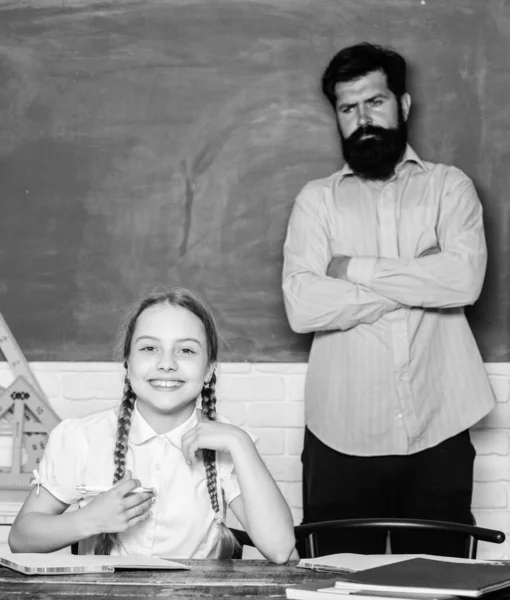 Talented pedagogue. Homeschooling with father. Find buddy to help you study. Private lesson. Pedagogue skills. School teacher and schoolgirl. Work together to accomplish more. Man bearded pedagogue