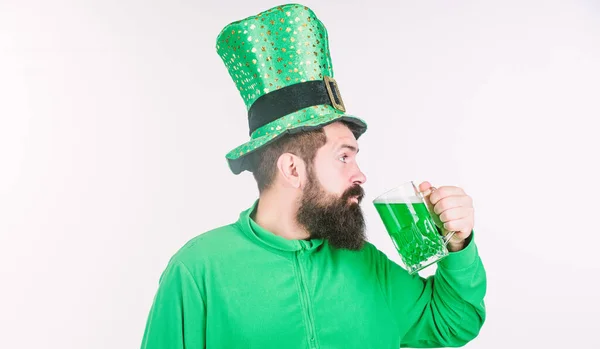 Green beer mug. Drinking beer part of celebration. Irish pub. Alcohol consumption integral part saint patricks day. Cheers concept. Irish tradition. Man brutal bearded hipster drink pint beer