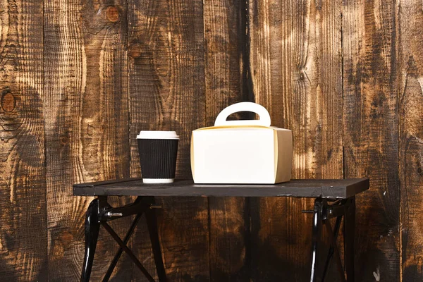 Paper cup with ladies handbag — Stock Photo, Image