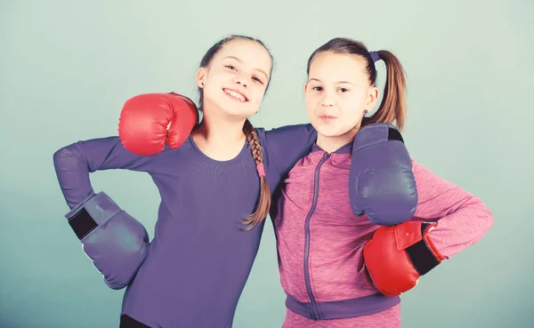 You can do it workout of small girls boxer in sportswear. Fitness diet. energy health. punching knockout. Childhood activity. Sport success. Friendship. Happy children sportsman in boxing gloves