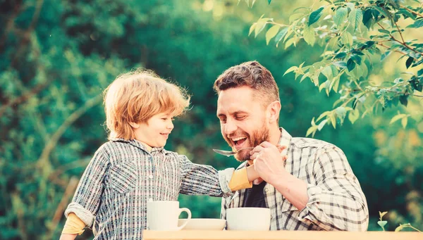 Organic and natural food. they love eating together. Weekend breakfast. father and son eat outdoor. small boy child with dad. healthy food. Family day bonding. Free time — Stock Photo, Image