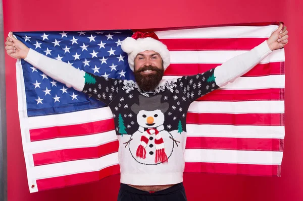 Love your country. Christmas in United States of America. Greetings to all my compatriots. American man hold USA flag. National spirit. Christmas holiday. Guy celebrate christmas. Cheerful hipster