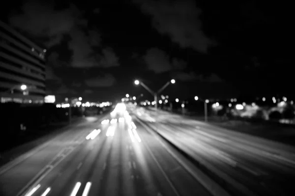 Blurred night city lights. defocused speed background. blur night life. illumination. Abstract urban night light defocused background. Nightscape Fuzzy. Abstract background of city in motion blur — Stock Photo, Image