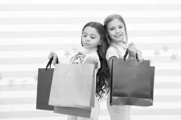 Total sale. Black friday. Shopping together. Buy clothes. Addicted buyer. Fashion boutique. Children in shop with bags. Shopping is best therapy. Shopping day happiness. Nice purchase. Great discount