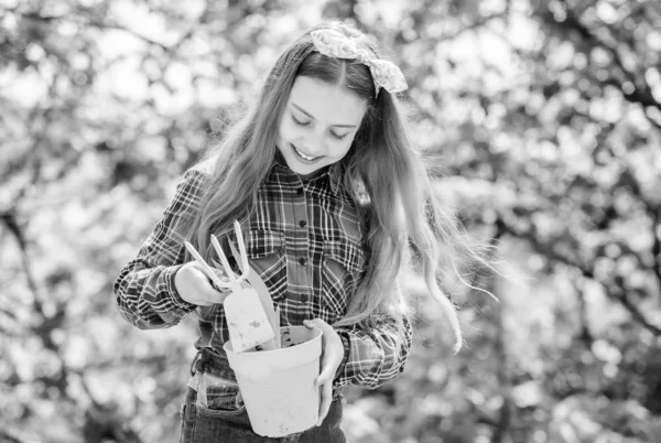 Enjoying her work with plants. spring village country. little girl kid in forest. little girl with gardening tools. earth day. ecology environment. Happy childrens day. summer farm. Happy childhood — Stock Photo, Image