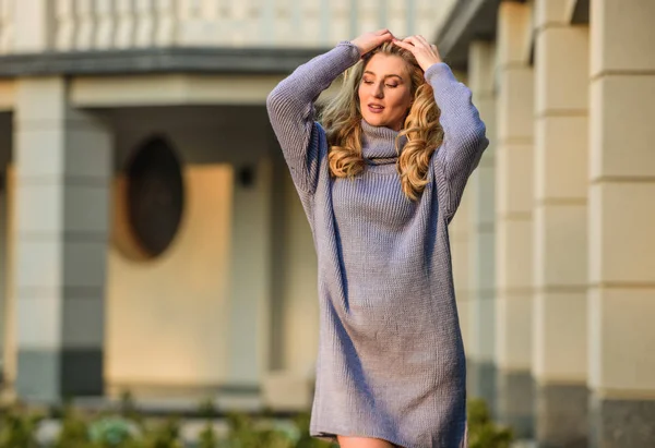 Warm oversized sweater. Free style comfortable. Woman wear sweater. Elongated sweatshirt tunic dress. Enjoy softness. Blonde girl make up face fall outfit. Knitwear concept. Cashmere woolen sweater — Stock Photo, Image