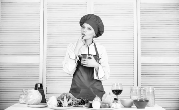 Restaurant menu. Dieting. professional chef in kitchen. woman in cook hat and apron. happy woman cooking healthy food by recipe. organic eating and vegetarian. Housewife. Calorie and diet — Stock Photo, Image