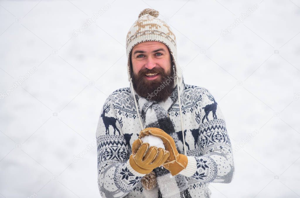 Holyday atmosphere. happy hipster play snowballs. man having fun outdoor. winter season. Christmas snow activity. winter holiday. Morning before xmas. bearded man in warm clothes. Happy new year
