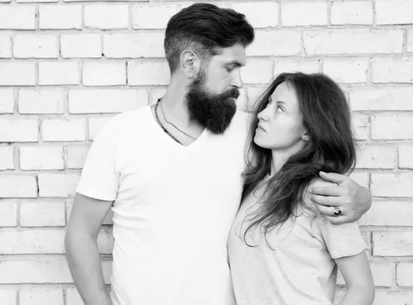 Moments of intimacy. Couple in love. Family couple hugging on brick wall. Loving couple of bearded man and sexy woman. Sensual couple together — Stock Photo, Image