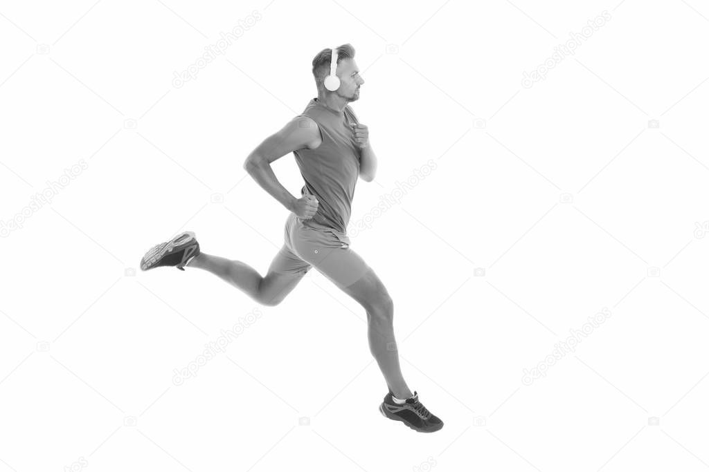 Feel the rhythm. Motivational song. Man sportsman running with headphones. Runner handsome strong guy motion isolated on white. Music for workout training. Run faster. Running sport. Keep running