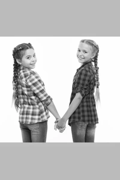 Happiness is friendship. Happy children hold hands isolated on white. Little girls enjoy friendship. International friendship day. Friendship bonds. Childhood friends — 스톡 사진