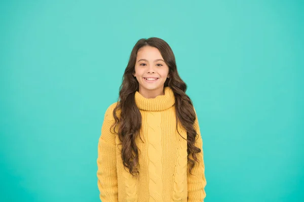 Positivity concept. Good vibes. Emotional baby. Positive child. Positive attitude to life. Inspiration. Positive mood. Kids psychology. Adorable smiling girl wear yellow sweater turquoise background — Stock Photo, Image