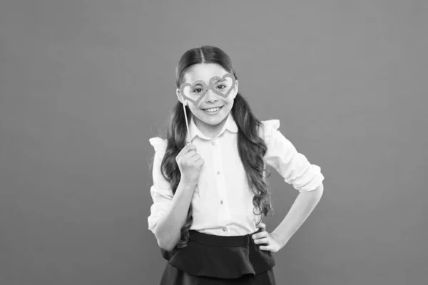 valentines day. child with party heart glasses. smart intelligent kid. back to school. love funny study. knowledge day. happy childhood. small girl student. school lover. school girl in uniform