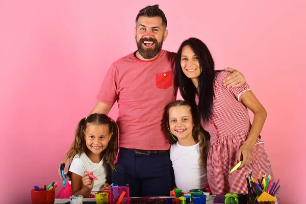 Girls, man and woman with happy faces by art desk — Stock Photo, Image