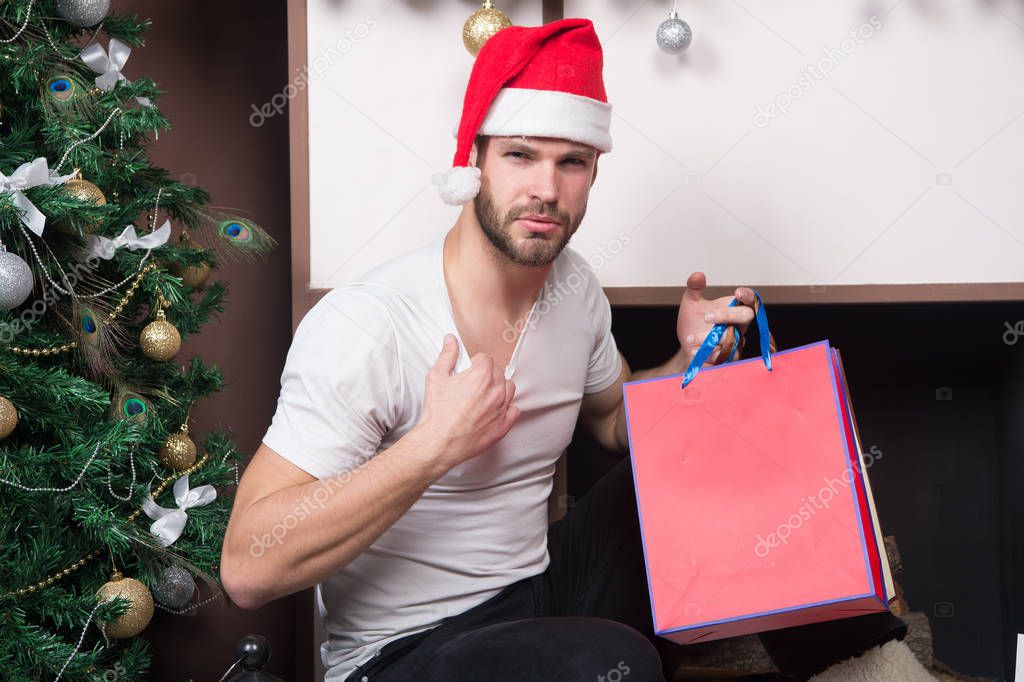 christmas shopping time. i will be your santa. secret present from sexy man. xmas composition at home. macho man shopping bag. gift for you. desire and temptation. happy new year. copy space