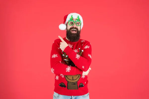 Winter presentation. Hipster bearded man wear winter clothes red background. Christmas celebration ideas. Happy new year celebration. Join holiday celebration. Party outfit. Sweater with deer — Stock Photo, Image