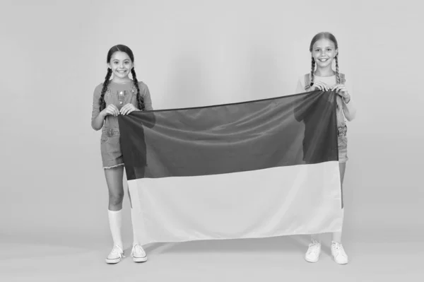 Ukrainian kids. Girls with blue and yellow flag. Patriotic education. Happy independence day. Children hold ukrainian flag. Patriotism respect and love to motherland. National identity concept