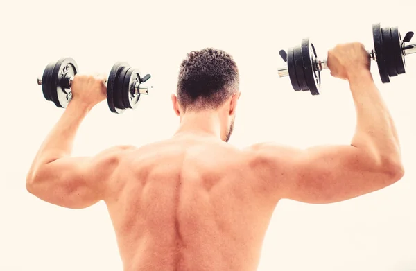 Hombre musculoso ejercitándose con mancuerna vista trasera. Las acciones hablan más fuerte que los entrenadores. Deportista con espalda y brazos fuertes. Equipamiento deportivo. Deporte culturismo. Estilo de vida deportivo. Gimnasio de ejercicio Dumbbell —  Fotos de Stock