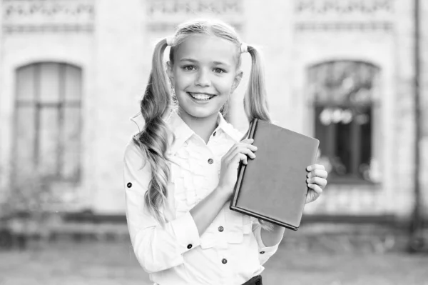 Ready for lessons. Secondary school student. Cute smiling small child hold book. Adorable little girl school student. Study language. School education concept. Cute little bookworm. Knowledge day