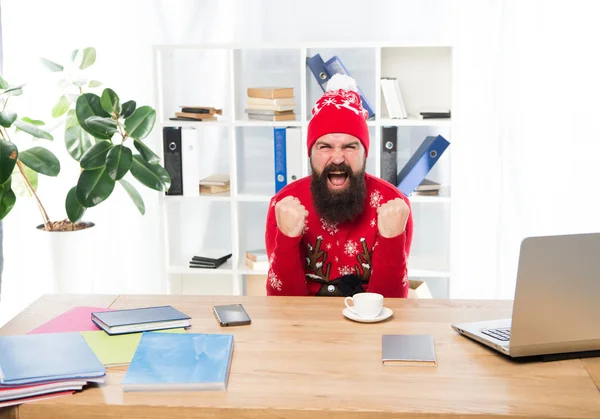 Oh yes. Bearded man celebrate victory in office. Happy businessman make winner gesture. Victory maker. Victory concept. Christmas season. Winter holidays. New year, victory year