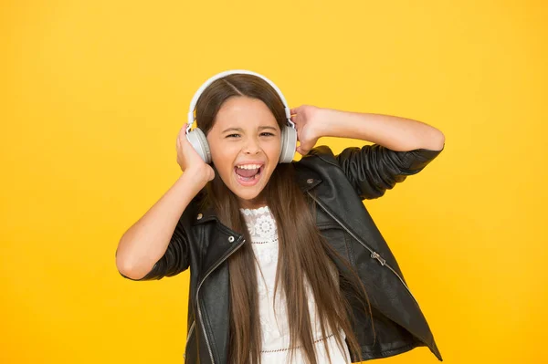 Lady DJ long hair. happy smile. hipster urban style girl. lifestyle concept. biker kid in headset. small girl in leather jacket. autumn fashion style. child listen rock music. little school radio dj — Stock Photo, Image