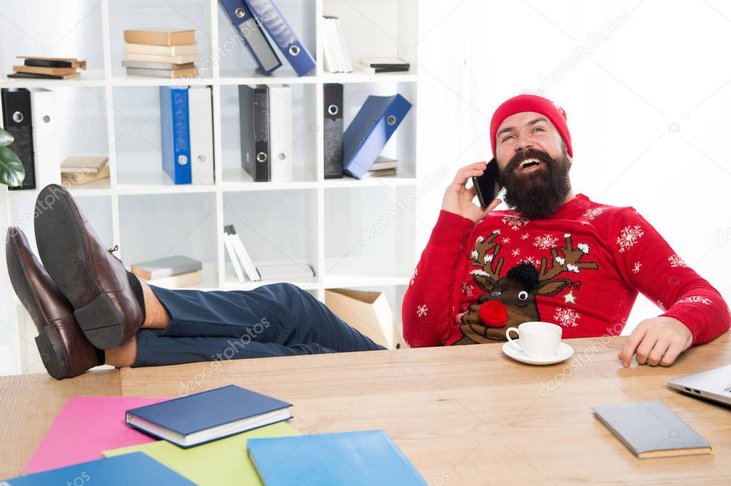Holiday mobile marketing. Hipster talk on phone in business office. Business man in winter style. Business communication. Season greetings to customers. Well-wishing makes business work