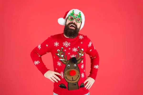 Ho ho ho. bearded man santa hat red wall. christmas is here. man in xmas party glasses. happy new 2020 year. funny hipster knitted sweater. knitwear fashion. winter holiday celebration — Stock Photo, Image