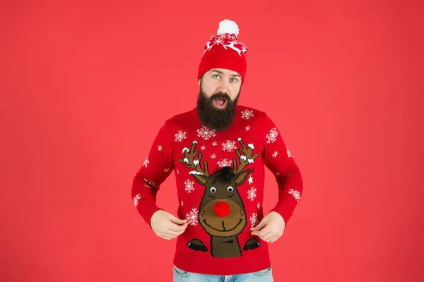 Eve of St Nicholas. surprised hipster red background. lets go shopping. time for choosing a gift. should i wear warm clothes. bearded man in knitted accessory. its christmas time. happy new year — Stock Photo, Image