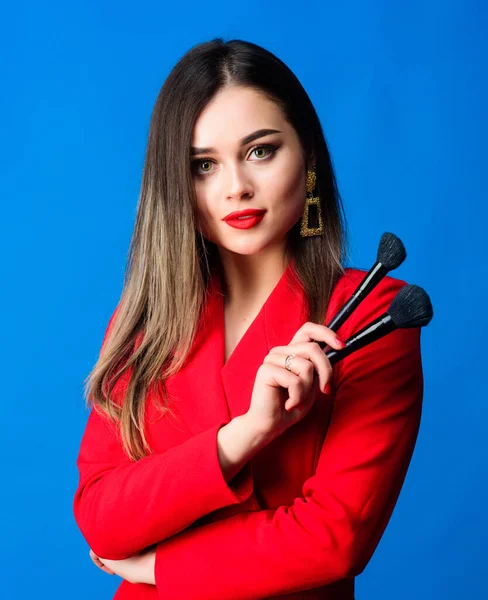 Perfect skin tone. Makeup artist concept. Girl apply powder cheeks. Looking good and feeling confident. Gorgeous lady makeup red lips. Attractive woman applying makeup brush. Hiding all imperfections