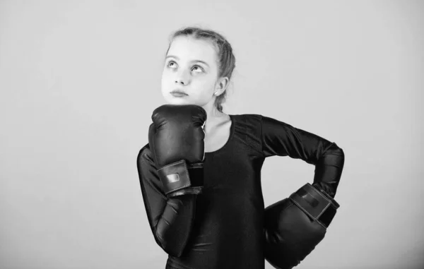Boxer child in boxing gloves. Female boxer change attitudes within sport. Rise of women boxers. Girl cute boxer on blue background. With great power comes great responsibility. Contrary to stereotype — Stock Photo, Image